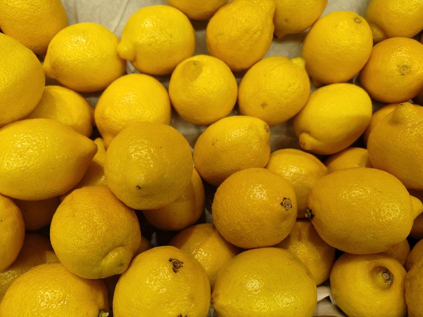 A vibrant collection of fresh lemons showcasing their bright yellow color.